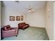 Bright living room featuring carpeted floors, a ceiling fan, and comfortable seating at 602 Painted Cloud Pl, Las Vegas, NV 89144