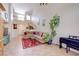 Bright living room featuring high ceilings, a staircase, and comfortable seating at 602 Painted Cloud Pl, Las Vegas, NV 89144
