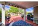Outdoor patio area with decorative sunshades, potted plants, and seating, perfect for relaxation at 602 Painted Cloud Pl, Las Vegas, NV 89144