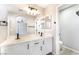 Bathroom features double vanity, large mirror, modern lighting, and walk-in closet at 6260 Castle Kennedy St, Henderson, NV 89011