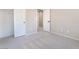 Neutral bedroom with carpeted floors and a walk-in closet with shelving at 6260 Castle Kennedy St, Henderson, NV 89011