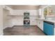 Bright kitchen with stainless steel appliances, white cabinets, and sleek countertops at 6260 Castle Kennedy St, Henderson, NV 89011