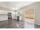 Kitchen boasts stainless steel appliances, white cabinets, and hardwood floors at 6260 Castle Kennedy St, Henderson, NV 89011