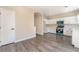 Kitchen boasts stainless steel appliances, white cabinets, and hardwood floors at 6260 Castle Kennedy St, Henderson, NV 89011
