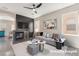 This living room features a fireplace with gray accent wall and neutral decor at 6260 Castle Kennedy St, Henderson, NV 89011