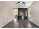 Bright living room features a fireplace with black accent wall and modern ceiling fan at 6260 Castle Kennedy St, Henderson, NV 89011