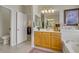 Bathroom with a toilet, and vanity, and a view to the closet in the main bedroom at 6440 Bristlebird St, North Las Vegas, NV 89084