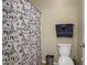 Cozy bathroom featuring a toilet and shower with a 'Paris' themed curtain at 6440 Bristlebird St, North Las Vegas, NV 89084