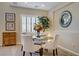 Cozy dining area featuring modern decor, elegant table setting, and lots of natural light at 6440 Bristlebird St, North Las Vegas, NV 89084