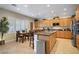 Spacious kitchen featuring stainless steel appliances, granite countertops, and center island with seating at 6440 Bristlebird St, North Las Vegas, NV 89084