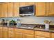 Well-appointed kitchen with modern appliances, granite countertops, and a gas cooktop at 6440 Bristlebird St, North Las Vegas, NV 89084
