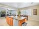 Open-concept kitchen features a center island and is perfect for entertaining guests at 6440 Bristlebird St, North Las Vegas, NV 89084
