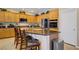 Gourmet kitchen with stainless steel appliances, granite countertops, and ample cabinet space at 6440 Bristlebird St, North Las Vegas, NV 89084