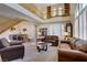 Large living room with high ceilings, an open staircase, and lots of natural light at 6440 Bristlebird St, North Las Vegas, NV 89084