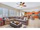 Spacious living room with an open layout, neutral decor, and seamless kitchen access at 6440 Bristlebird St, North Las Vegas, NV 89084