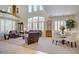 Bright, open living room with high ceilings, neutral colors, and ample natural light at 6440 Bristlebird St, North Las Vegas, NV 89084