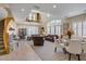 Open-concept living space featuring vaulted ceilings, tile floors, and views of the upstairs loft at 6440 Bristlebird St, North Las Vegas, NV 89084