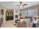 Comfortable living room with a fireplace, custom shelving, and ample seating at 6440 Bristlebird St, North Las Vegas, NV 89084