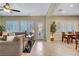 Inviting living room with tile floors, modern lighting and stylish decor at 6440 Bristlebird St, North Las Vegas, NV 89084