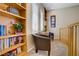 Well-lit loft featuring built-in bookshelves and comfortable seating area at 6440 Bristlebird St, North Las Vegas, NV 89084