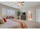 Spacious main bedroom with plantation shutters and ceiling fan at 6440 Bristlebird St, North Las Vegas, NV 89084