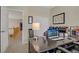 Home office view, with a long desk and open access to second floor at 6440 Bristlebird St, North Las Vegas, NV 89084