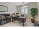 Office with dark wood furniture and natural light at 6440 Bristlebird St, North Las Vegas, NV 89084