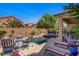 Relaxing backyard oasis with a private pool, lounge chairs, and a covered patio perfect for entertaining at 6440 Bristlebird St, North Las Vegas, NV 89084