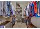This walk-in closet has ample storage and shelving for shoes, clothing, and personal items at 6440 Bristlebird St, North Las Vegas, NV 89084