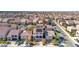 Wide-angle photo of a suburban neighborhood featuring well maintained homes with red tile roofs at 6714 Flamenco Ct, Las Vegas, NV 89139