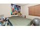 Bedroom features large Spider-Personal wall art, window with blinds, and neutral walls, creating a themed, comfortable space at 6714 Flamenco Ct, Las Vegas, NV 89139