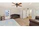 Comfortable bedroom features large windows, carpeted floors, and a plush bed and seating area at 6714 Flamenco Ct, Las Vegas, NV 89139