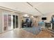 Bonus room with exercise equipment, a work space, and sliding glass doors, offering versatility and natural light at 6714 Flamenco Ct, Las Vegas, NV 89139