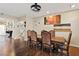 Formal dining room features hardwood floors, modern lighting, and a decorative painting at 6714 Flamenco Ct, Las Vegas, NV 89139