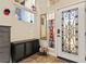 Entryway with decorative front door, unique lighting, and storage cabinets offering both style and functionality at 6714 Flamenco Ct, Las Vegas, NV 89139