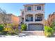 Charming two-story home with a brick driveway, covered balcony, and well-maintained landscaping at 6714 Flamenco Ct, Las Vegas, NV 89139