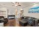 Inviting living room with hardwood floors, comfortable seating, and a cozy atmosphere at 6714 Flamenco Ct, Las Vegas, NV 89139
