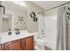 Bathroom featuring cherry wood vanity and updated faucet and shower head at 6869 Desert Thrasher Dr, North Las Vegas, NV 89084