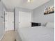 Bright bedroom with a closet, ceiling fan, and access to the hallway at 6869 Desert Thrasher Dr, North Las Vegas, NV 89084
