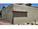 Pavona community sign detail against textured wall, enhanced by landscaping and sunny skies at 6869 Desert Thrasher Dr, North Las Vegas, NV 89084