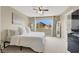 Bright main bedroom with large window, neutral colors and great natural light at 6869 Desert Thrasher Dr, North Las Vegas, NV 89084