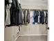 Spacious walk-in closet with plenty of room to hang clothing with an open space for shoes and personal items at 6869 Desert Thrasher Dr, North Las Vegas, NV 89084