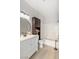 This bathroom features a modern vanity, updated fixtures, decorative shelves, and a tub/shower combo at 7155 S Durango Dr # 309, Las Vegas, NV 89113