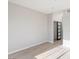 This spacious bedroom features light wood floors, neutral walls, and a closet with black framed doors at 7155 S Durango Dr # 309, Las Vegas, NV 89113