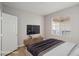 This staged bedroom features modern decor, a window, and a spacious layout at 7155 S Durango Dr # 309, Las Vegas, NV 89113