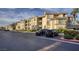 A well-maintained exterior building with parking, landscaping and multiple units at 7155 S Durango Dr # 309, Las Vegas, NV 89113