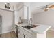 Modern kitchen with sleek appliances, breakfast bar, and plenty of counter space at 7155 S Durango Dr # 309, Las Vegas, NV 89113
