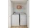 The laundry closet features a stacked washer and dryer, and a shelf for storage at 7155 S Durango Dr # 309, Las Vegas, NV 89113