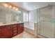 Bright bathroom featuring double sinks, a separate shower, and a soaking tub at 75 Archer Glen Ave, Henderson, NV 89002