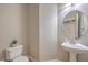 Powder room features a modern pedestal sink and stylish fixtures at 75 Archer Glen Ave, Henderson, NV 89002